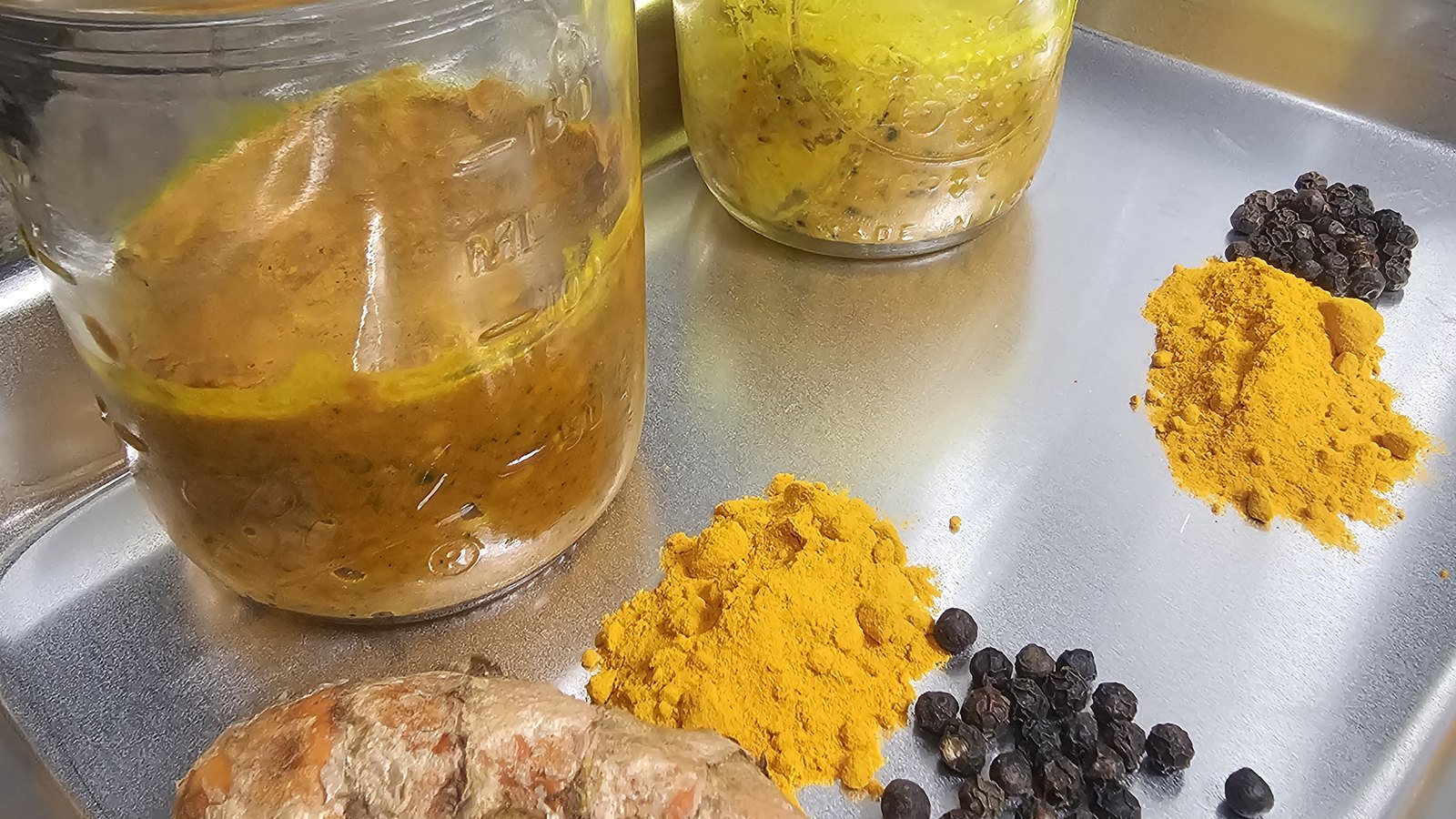 Turmeric root and black pepper, both on the filed label.